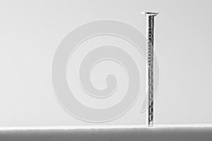 Metal nail isolated on white background. working tools
