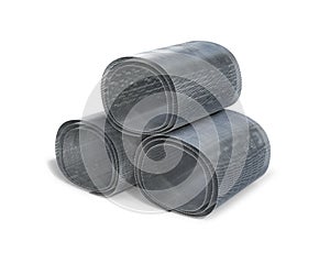 Metal net rolled up in three stacks.
