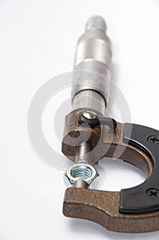 Metal nut tightened in micrometers