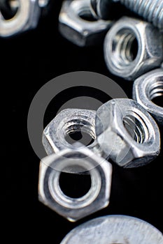 Metal nuts and bolts background. Macro. Working tools. Fixing elements.