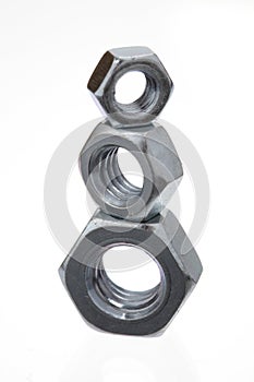Metal nuts tower, closeup