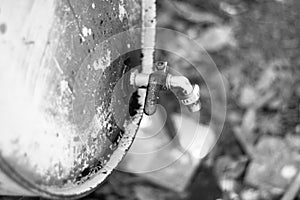 Metal oil barrel with a taps in black and white