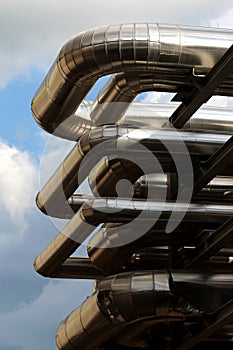 Metal oil pipe in refinery under sky