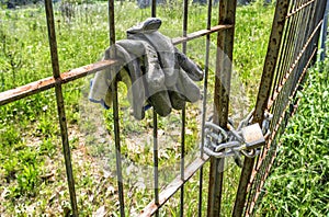 Metal old fence closed with padlock and security chain