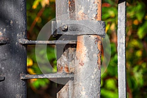 Metal old pipe with a clamp with a bolt