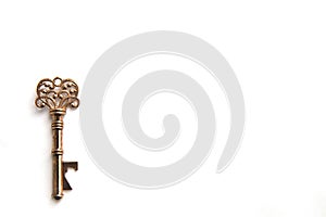 Metal openwork key on white background isolate