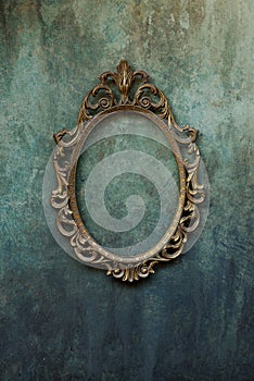 Metal oval frame on a wall