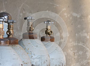 metal oxygen cylinders on a wall background.