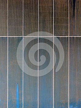 Metal panels with streaks of brown and blue rust