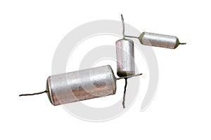 Metal-paper capacitors with green ends. set of different rate vintage electronic parts of circuit of tube sound-amplifying