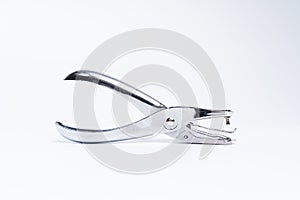 Silver metallic hole puncher.