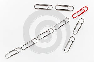 Metal paperclips, shape of arrow up, red on top