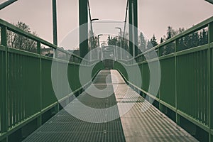 metal pedestrian bridge details in city of Bauska, Latvia - vintage retro look