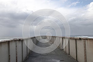 Metal Pedestrian Bridge with the Sea as a Backdrop