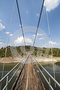 Metal pedestrian suspension bridge