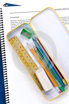 Metal pencil case and book