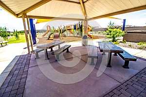 Metal Picnic Tables And Benches At Children\'s Playground