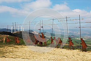 Metal pilgrim statues in Puerto del Perdon mountain port, Camino de Santiago, Navarra, Spain photo