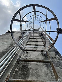 metal pipe with staircase on old dam