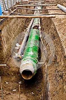 Metal pipes lieing in the trench.