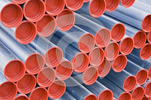 Metal pipes with red caps