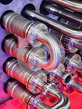 Metal pipes and tubes in a complex assembly showcasing modern engineering design and precision craftsmanship at an industrial