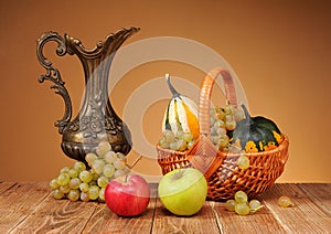 Metal pitcher and fruit