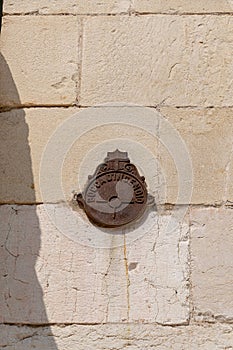 Plate reading bocca d`incendio on the wall of Verona cathedral, Italy photo