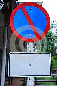 Metal Plate, Traffic Prohibitory Sign: Parking is prohibited, No Parking. The sign, usually shown as a red diagonal bar inside a b