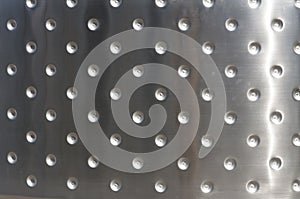 Metal plates with rivets background or texture photo