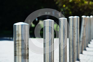 Metal poles to restrict traffic in pedestrian areas. Close-up