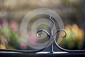 Metal pommel on a lily-shaped fence