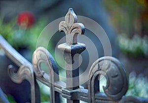 Metal pommel on a lily-shaped fence