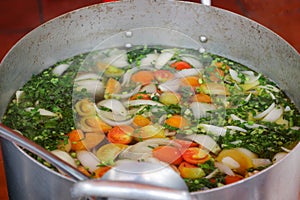 Metal pot with Cambodian vegetarian soup