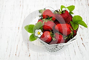 Metal pot with strawberries