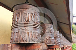 Metal prayer wheels from Buddhism Tibetan monastery of Nepal