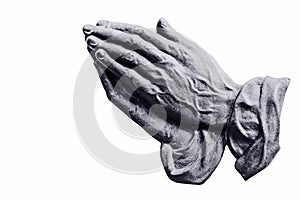 Metal praying hands on a white background