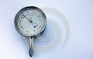 Metal pressure gauge on white isolate