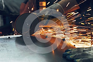 Metal processing with angle grinder. Sparks in metalworking