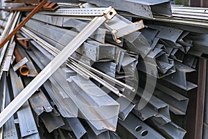 Metal profile channel at a construction site in the form of scrap metal