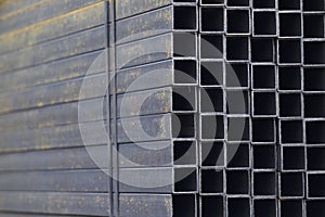 Metal profile pipe of rectangular cross section in packs at the warehouse of metal products