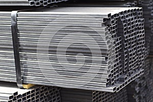 Metal profile pipe of rectangular cross section in packs at the warehouse of metal products