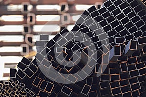 Metal profile pipe of rectangular cross section in packs at the warehouse of metal products