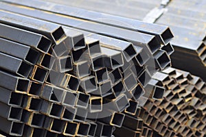 Metal profile pipe of rectangular cross section in packs at the warehouse of metal products