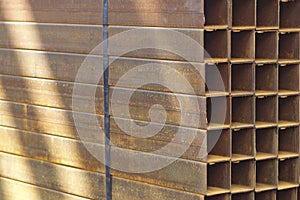 Metal profile pipe of rectangular cross section in packs at the warehouse of metal products