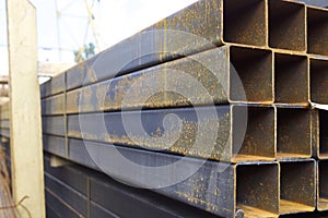 Metal profile pipe of rectangular cross section in packs at the warehouse of metal products