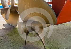 Metal propeller on retired frigate on display at public park