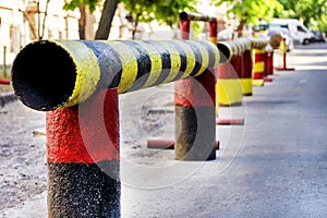 Metal protections on the city street. Restrictions of the movement in time repair work in the city.