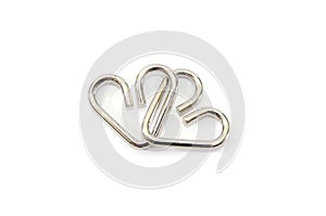 Metal puzzle in the form of hearts on a white background.