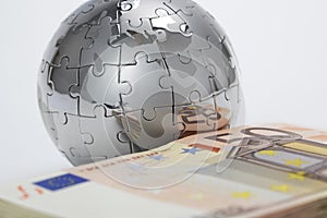 Metal puzzle globe with money